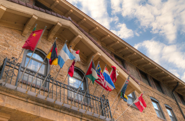 ILC flags swaying outside their Lakeshore residence hall