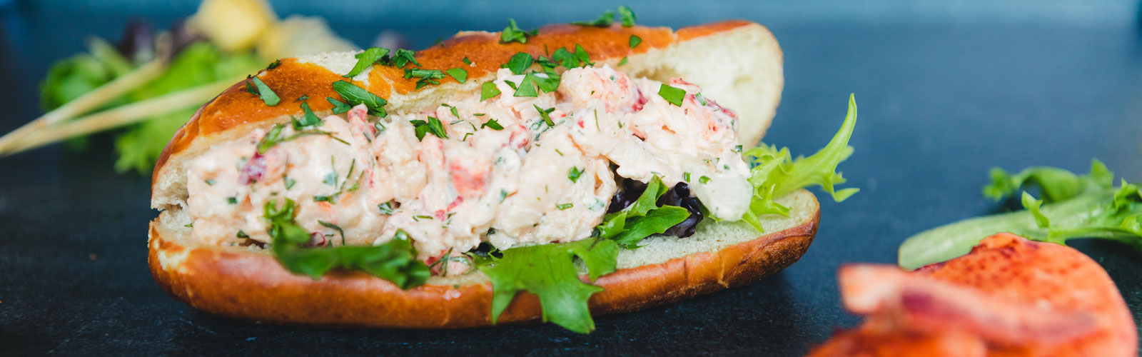 A close-up of a Lobster Roll Sandwich created by the made from scratch by chefs in Dining & Culinary Services.