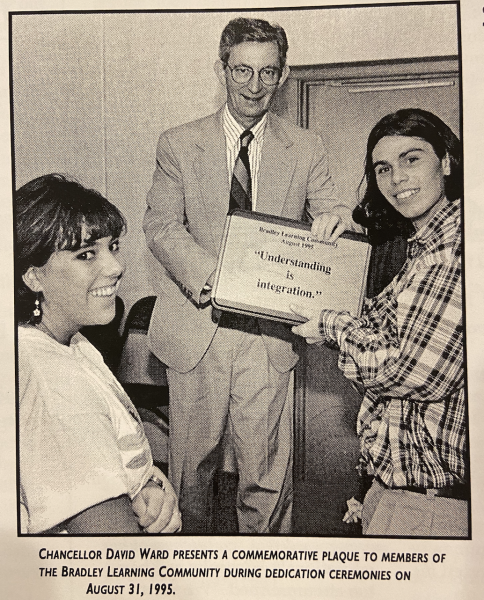 Chancellor Ward presents a commemorative plaque to BLC