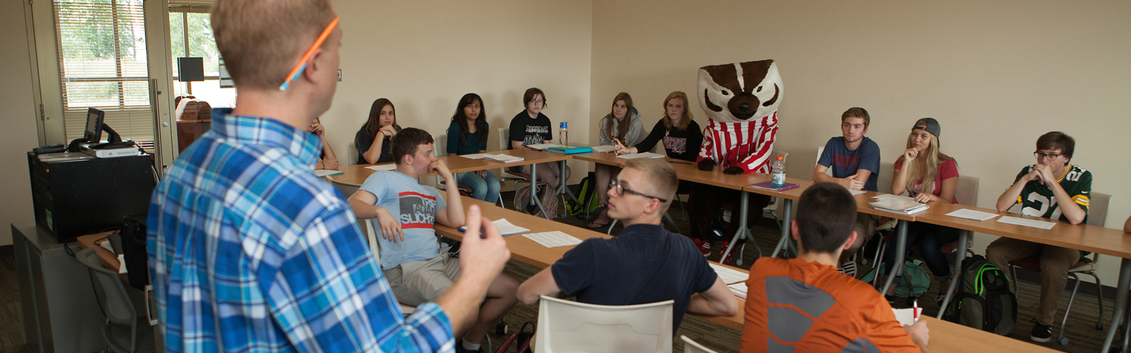 Students in a class section at Dejope Hall with Bucky
