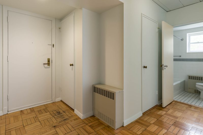 The hallway in a 1 Bedroom University Houses apartment.