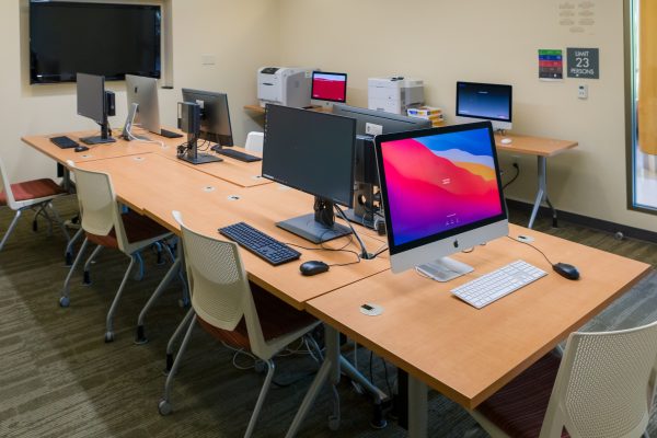 Computers on tables in the Dejope Residence Hall Media Center