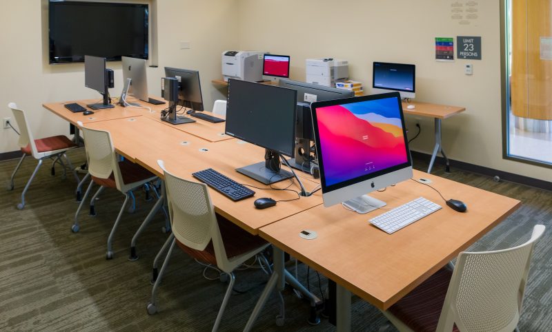 Computers on tables in the Dejope Residence Hall Media Center