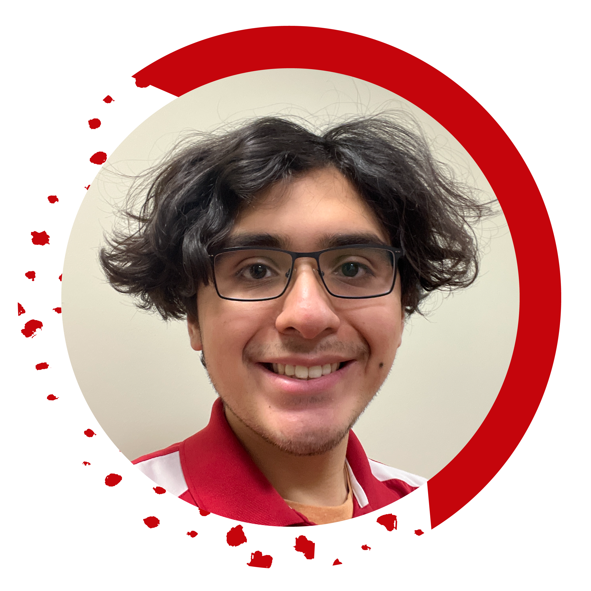 A student employee, Desiderio L., smiles at for a portrait
