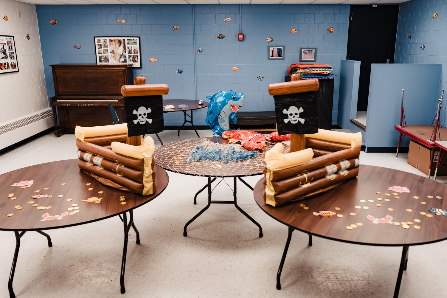 Pirate ship-themed decorations on tables and walls