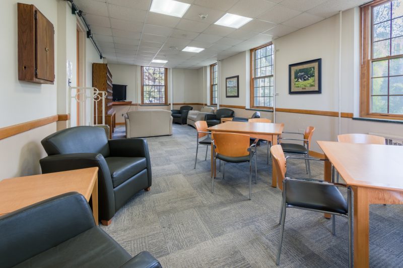 Tables and chairs in a lounge in Humphrey Residence Hall