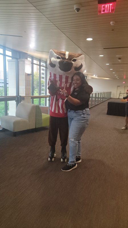 Badger Welcome Dinner - Bucky posing with resident