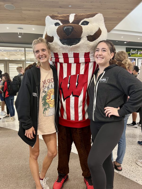 Bucky posing with students at Shake Smart