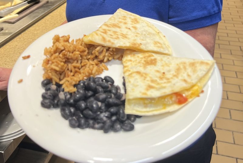 Quesadillas plated with rice and beans